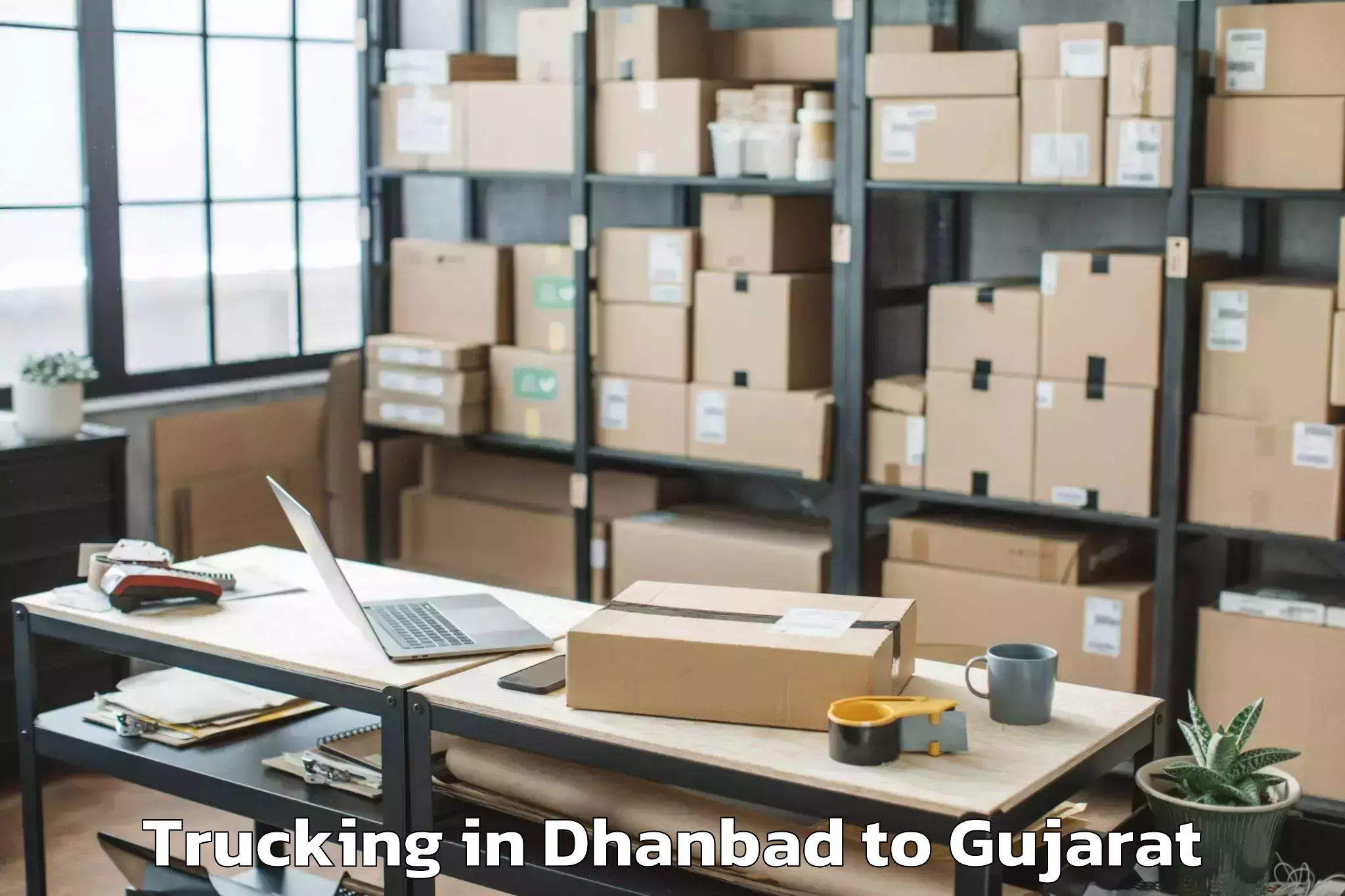 Quality Dhanbad to Vansada Trucking